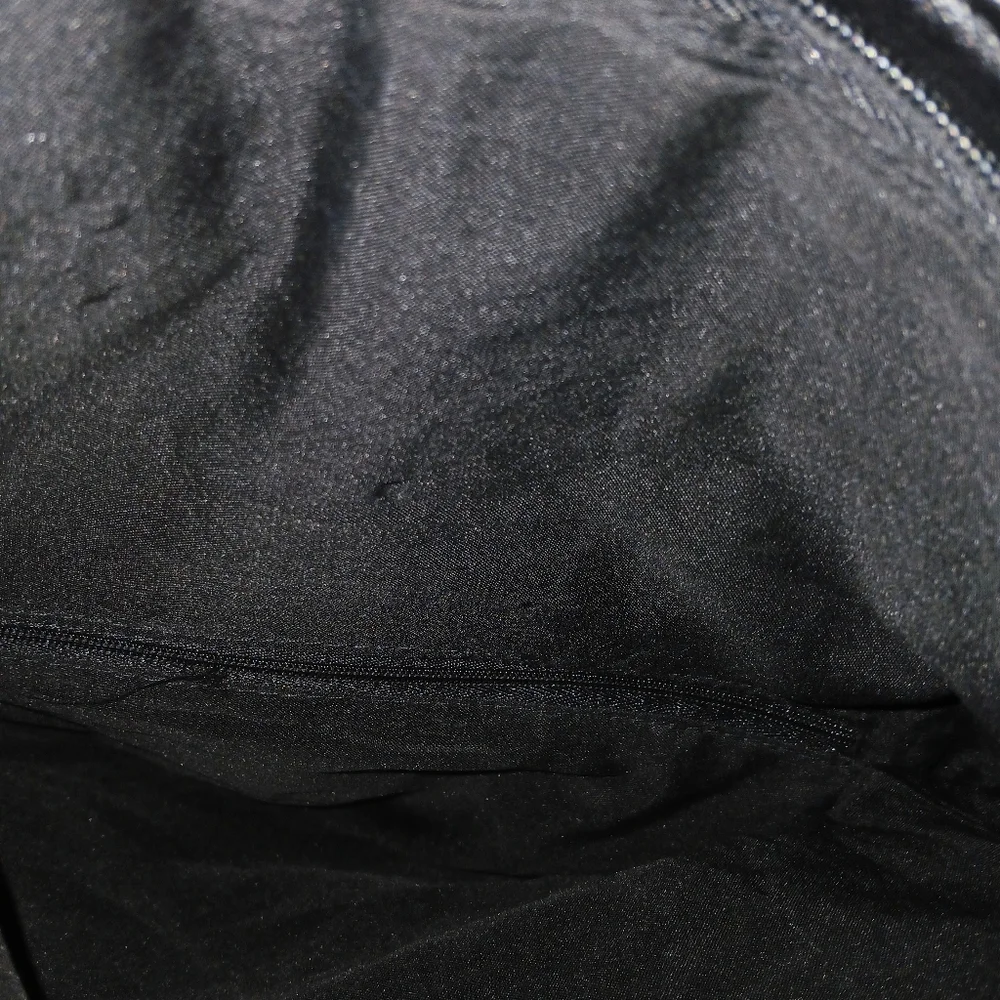 NOATD Elegant Black Clutch with Floral Design.